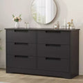 Commode six tiroirs à poignées intégrées, une unité de rangement compacte et peu encombrante, idéale pour les salons et les couloirs.