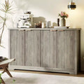 Modern decorative storage sideboard with grooved detailing, featuring doors and shelves. Crafted from wood, ideal for living rooms, entryways
